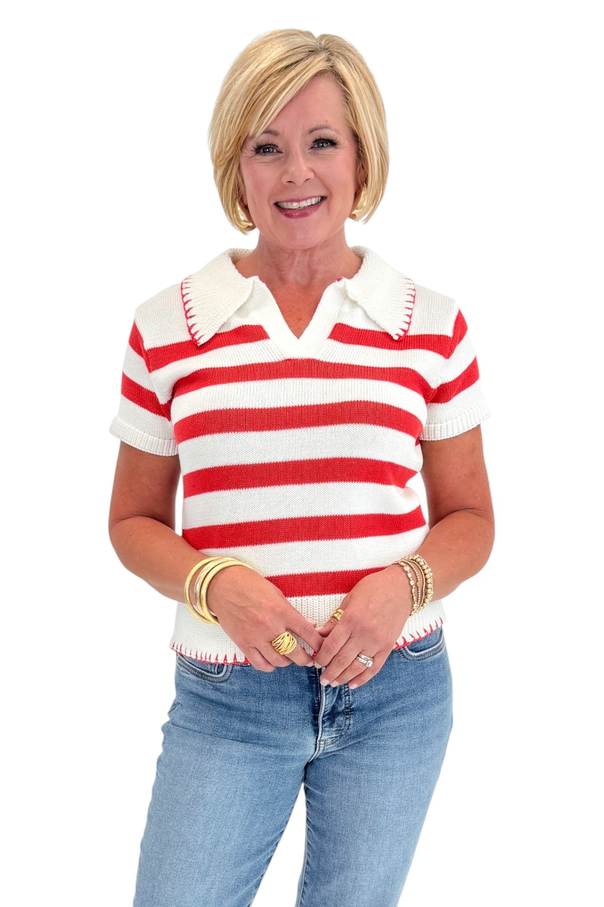 Front view of woman wearing Swagger Boutique’s Cream &amp; Coral Striped Knit Top with jeans against white studio background.