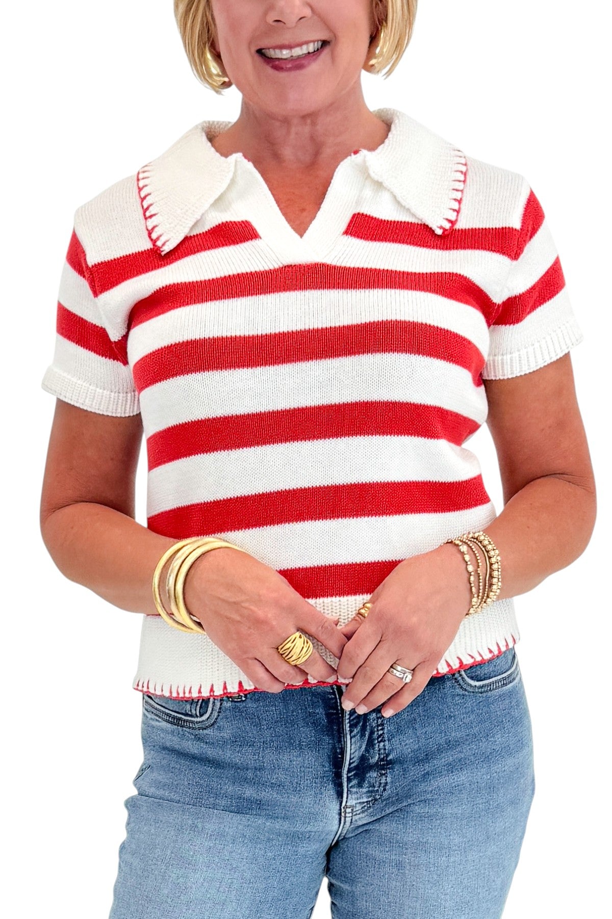 Front detail view of woman wearing Swagger Boutique’s Cream &amp; Coral Striped Knit Top with jeans against white studio background.