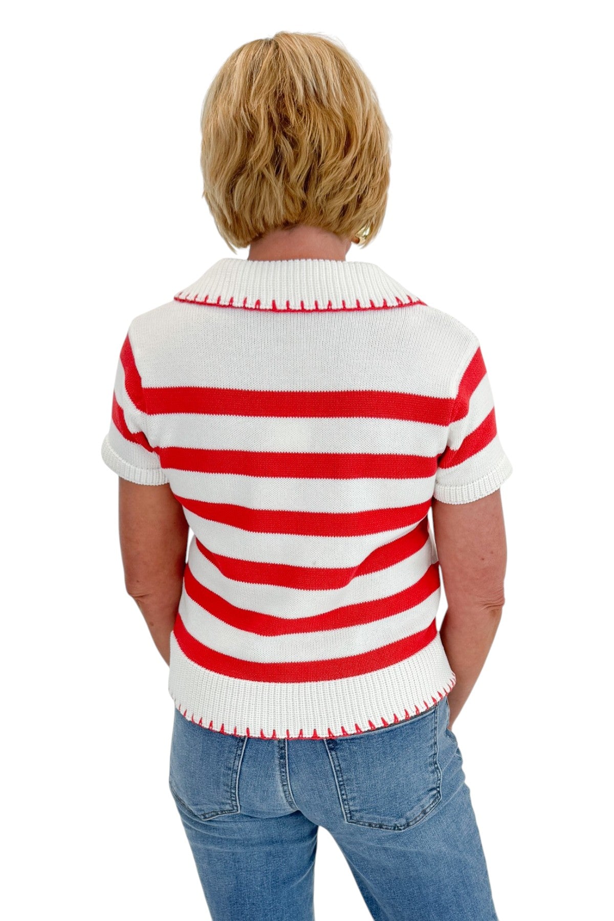 Back view of woman wearing Swagger Boutique’s Cream &amp; Coral Striped Knit Top with jeans against white studio background.