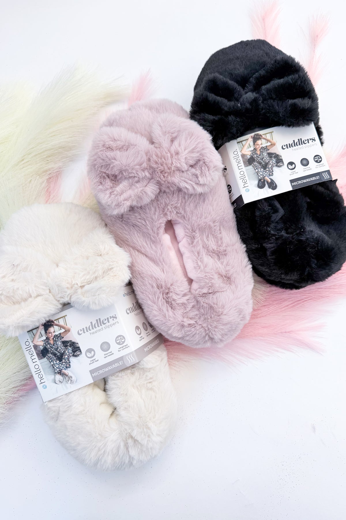 Cuddlers Heated Slippers against studio background.