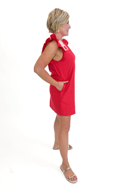 Side view of woman wearing Red Crochet Detail Mini Dress against white studio background.