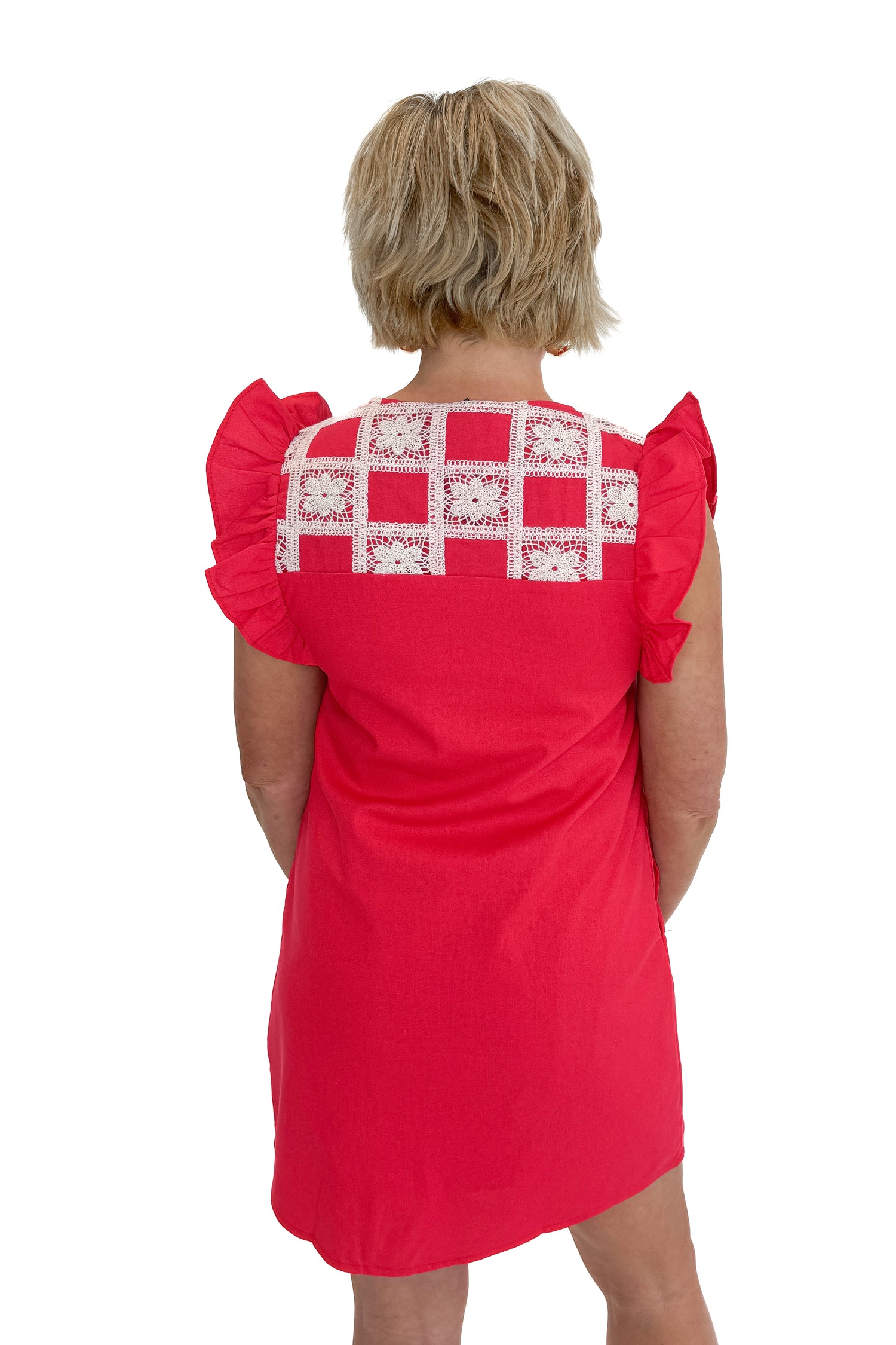 Back view of woman wearing Red Crochet Detail Mini Dress against white studio background.
