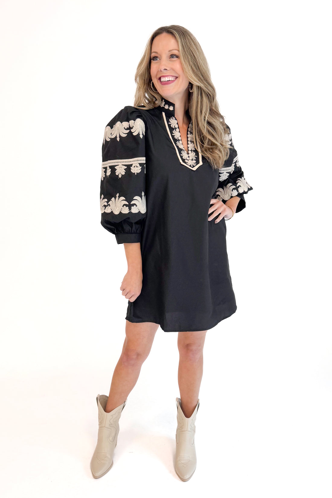 Front view of woman in Black With Cream Embroidery Puff Sleeve Dress by Entro.