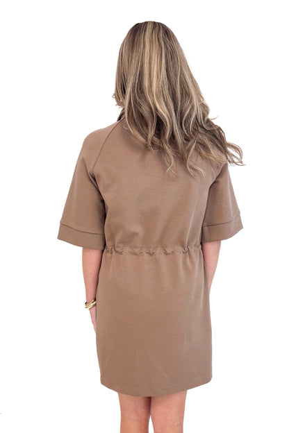 Woman wearing Fireside Glow Mocha 1/4 Zip Half Sleeve Dress by Entro - rear view showing half sleeves