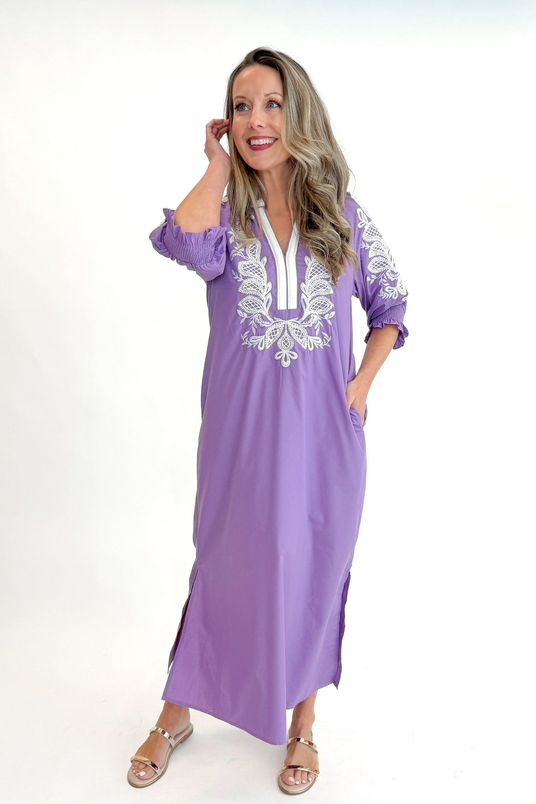 Front view of woman wearing Lavender Embroidered V-Neck Half Sleeve Midi Dress by Entro against white studio background.