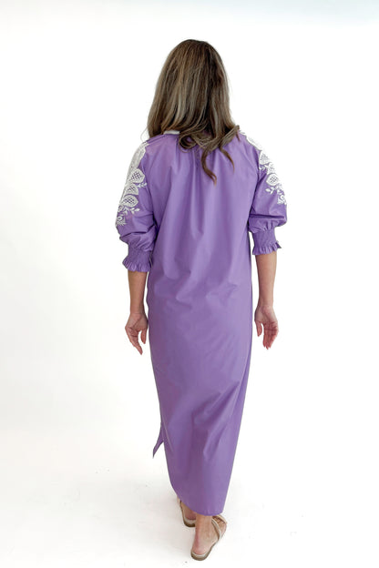 Back view of woman wearing Lavender Embroidered V-Neck Half Sleeve Midi Dress by Entro against white studio background.