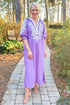Front view of woman wearing Lavender Embroidered V-Neck Half Sleeve Midi Dress by Entro outside at a garden.