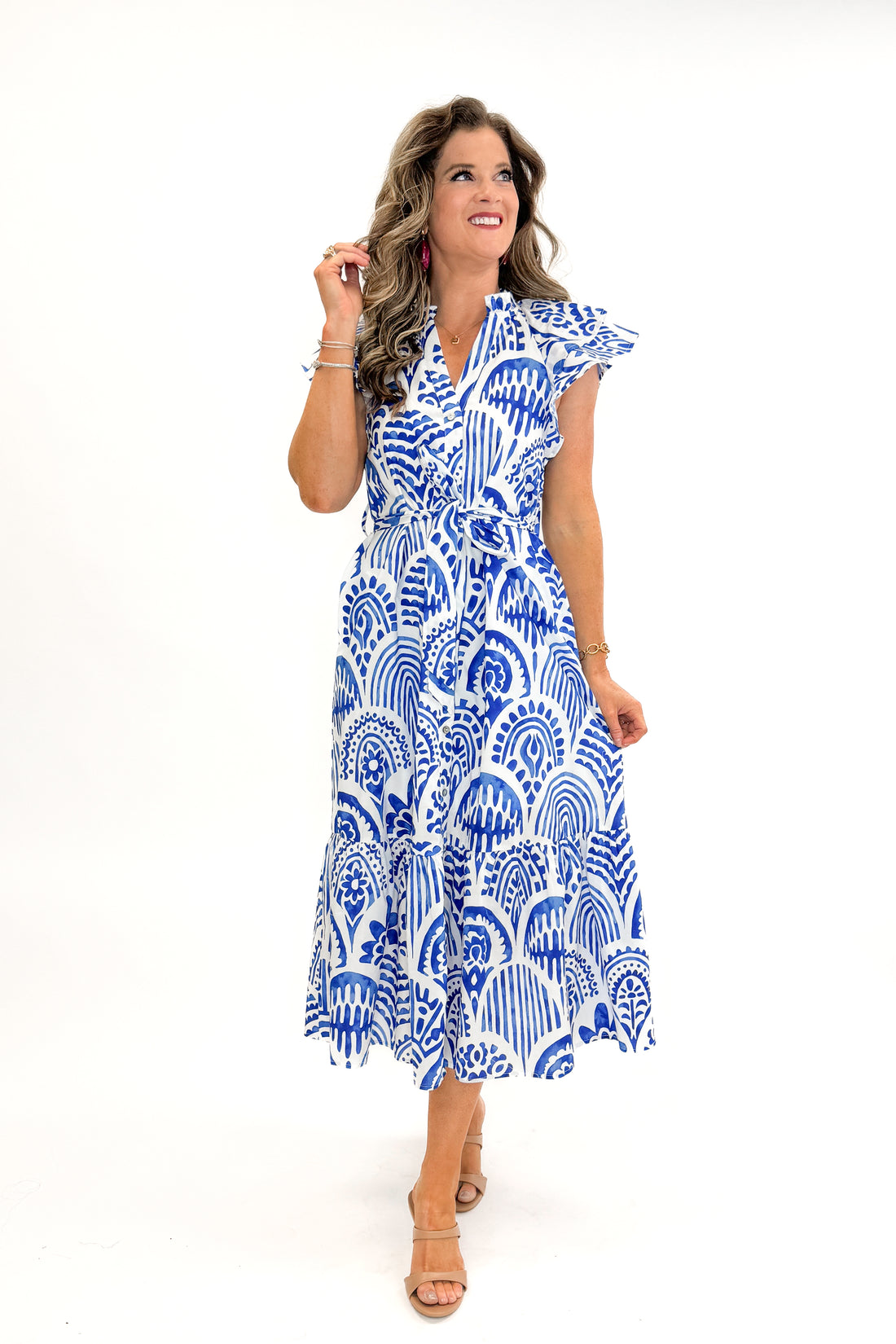Front view of woman wearing Blue Botanical Print Midi Dress by Entro against white studio background.