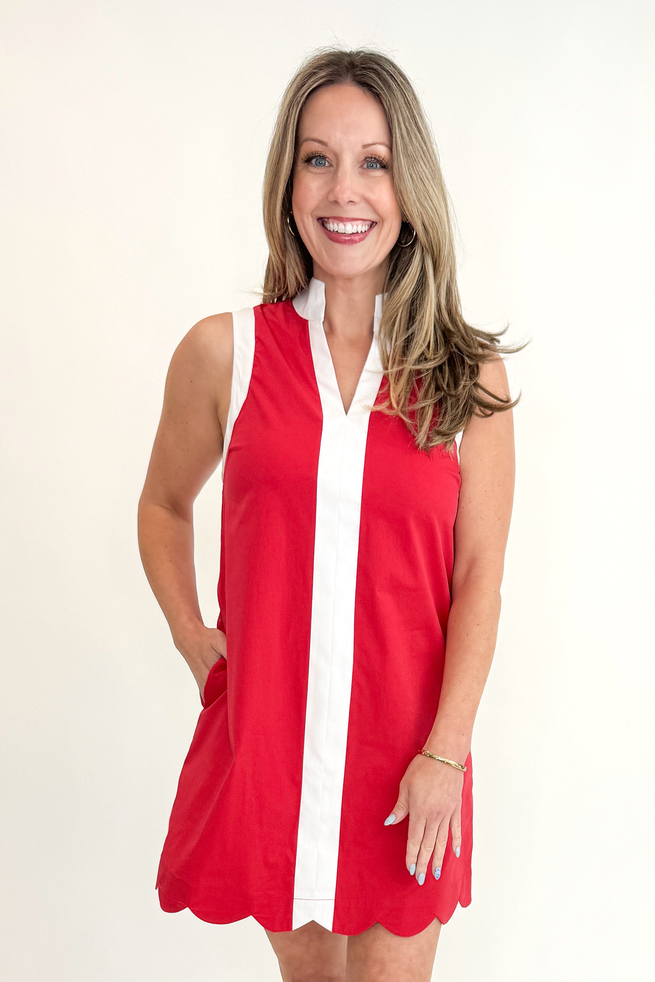 Front view of woman wearing Red With Center Stripe Scallop Hem Dress by Entro against white studio background.