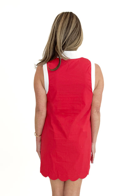 Back view of woman wearing Red With Center Stripe Scallop Hem Dress by Entro against white studio background.