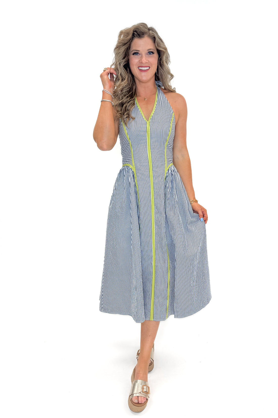 Front view of woman wearing Navy With Green Stripe Detail Halter Midi Dress by Entro with sandals against white studio background.