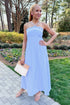 Front view of woman wearing Blue Striped Embroidered Halter Neck Maxi Dress by Entro at an outdoor garden.