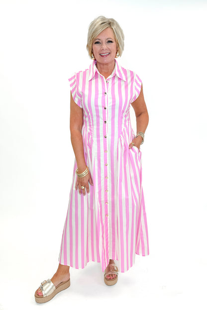Front view of woman wearing Pink Striped Button Down Midi Dress by Entro with sandals against white studio background.