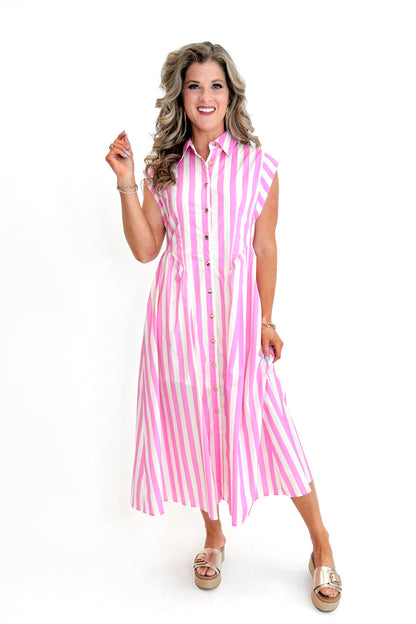 Front view of woman wearing Pink Striped Button Down Midi Dress by Entro with sandals against white studio background.