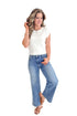Front view of woman wearing Medium Wash Seam Detail Wide Leg Jeans by Just Black Denim with white top against white studio background.