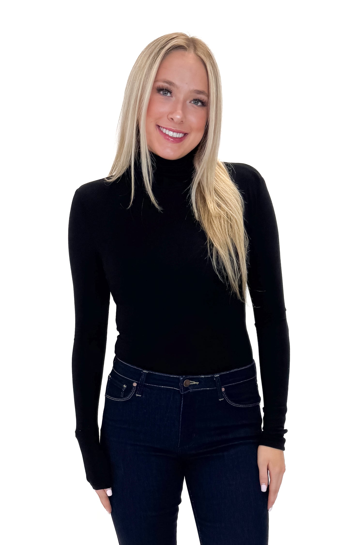 Front view of woman wearing Black Turtleneck Bodysuit with jeans against white studio background.