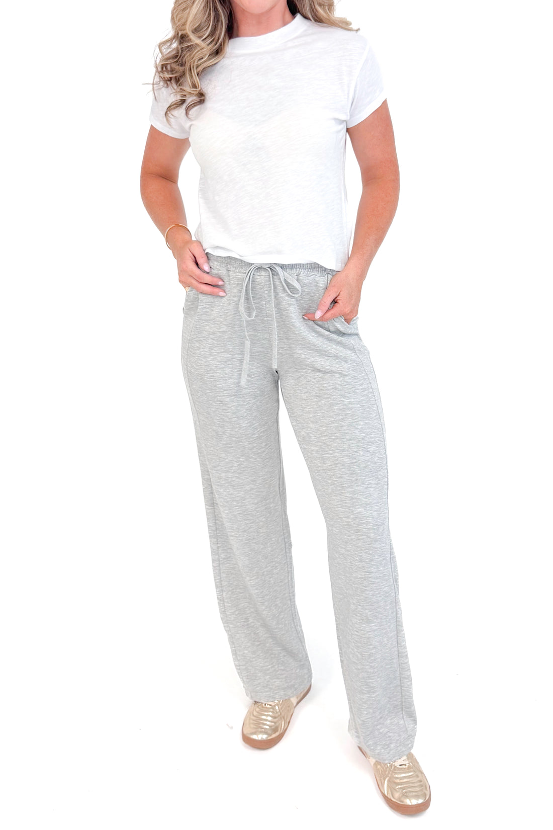 Front view of grey sweatpants and white top.