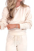 Front detail view of Woman wearing cream Crew Neck Sweatshirt and matching sweatpants. 