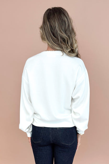Women wearing White Crew Neck Sweatshirt and blue jeans back view. 