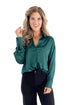 Front view of woman wearing Green Satin Collared V-neck Top with jeans against white studio background.