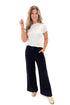 Front view of woman wearing Black Brushed Wide Leg Sweatpants with white top against white studio background.