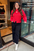 Front view of woman wearing Red Seam Split Detail Sweater with jeans at a boutique.