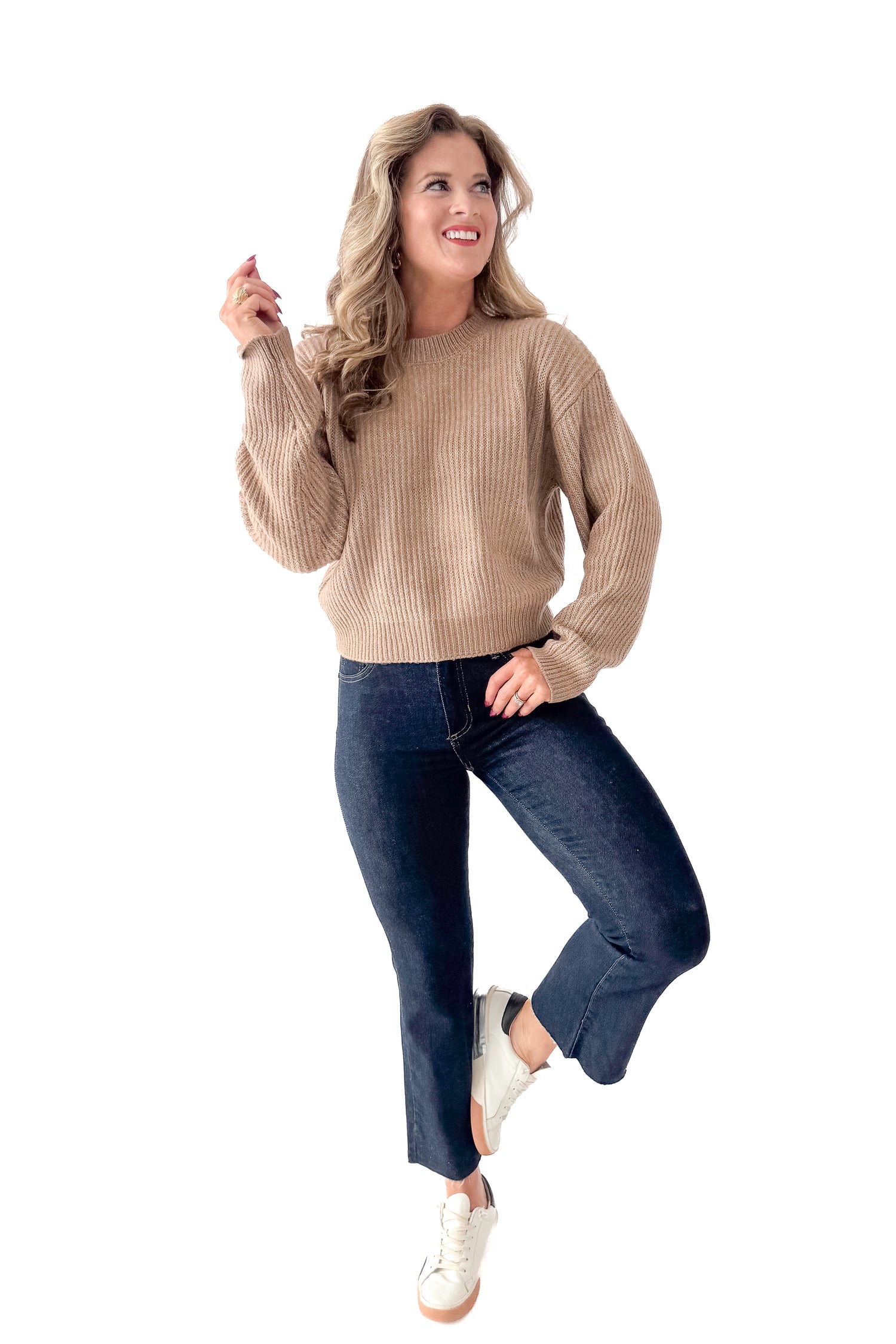 Front view of woman wearing Dark Taupe Ribbed Sweater with jeans against white studio background.