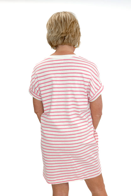 Back view of woman wearing Pink &amp; Cream Striped Short Sleeve Dress against white studio background.