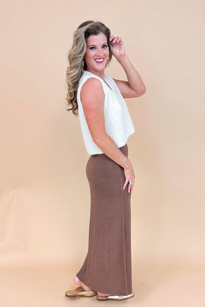 Woman wearing Soft Spot Cream Scoop Neck Sweater Tank - side view showing skirt and sleeveless design