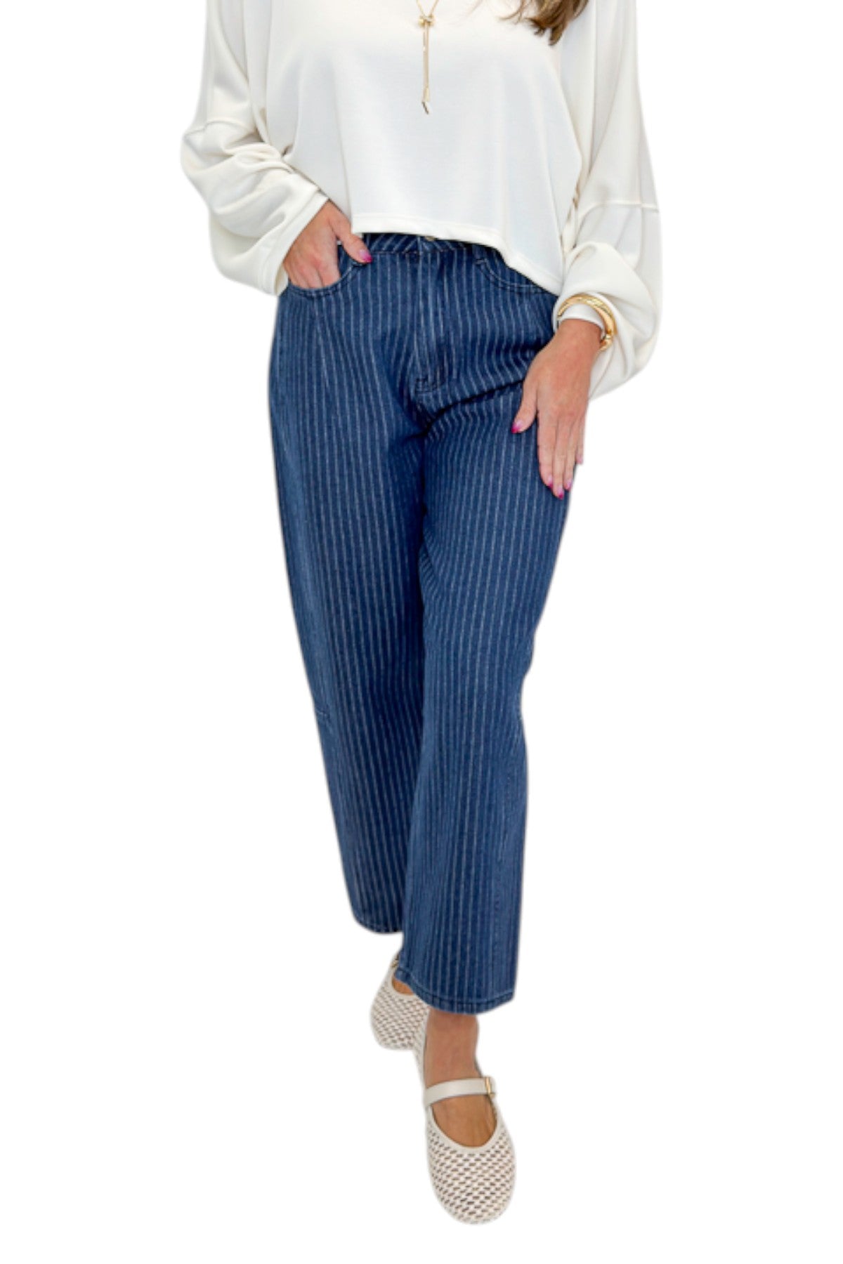 Front view of woman wearing Swagger Boutique’s Dark Wash Pinstriped Barrel Jeans with top against white studio background.