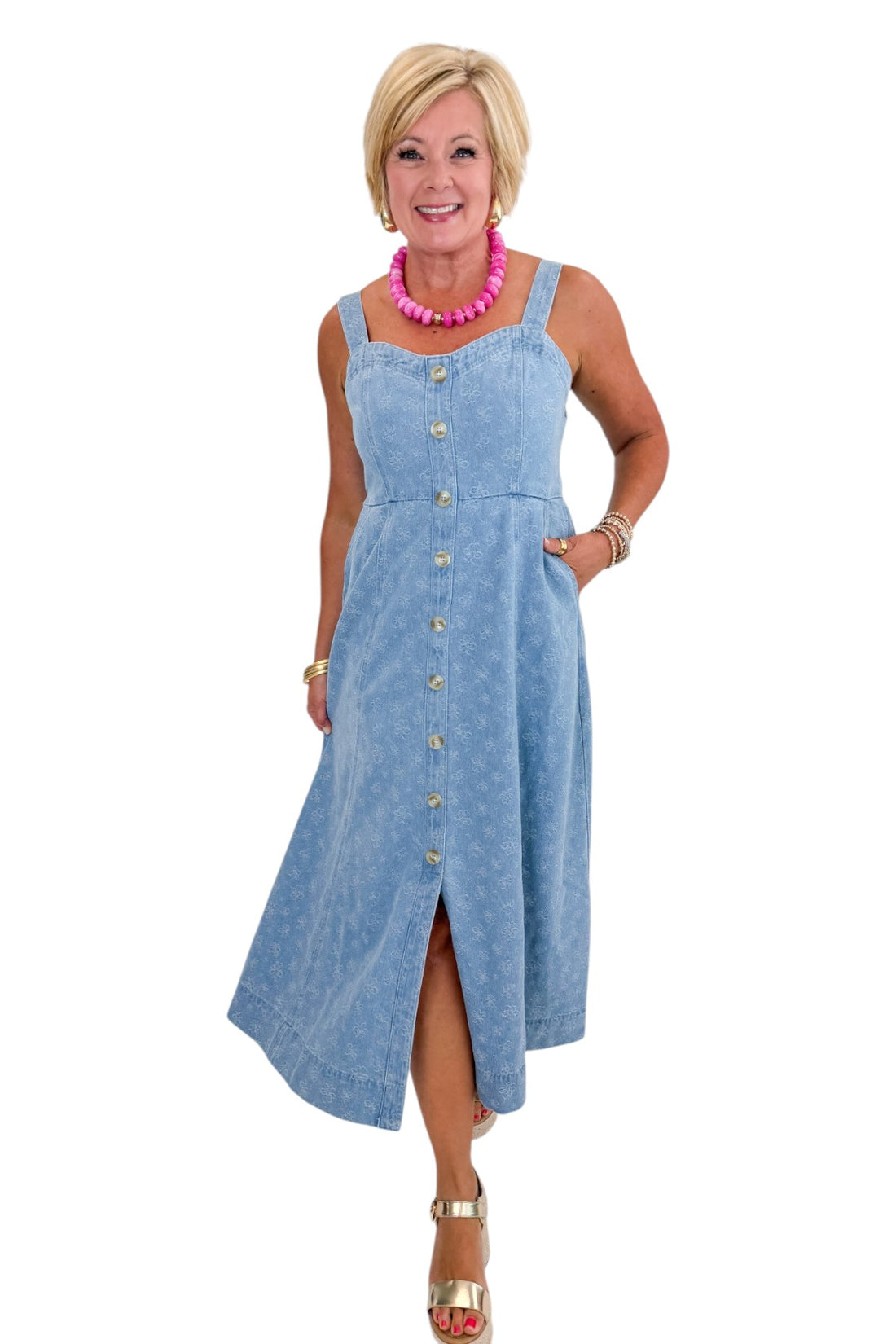 Front view of woman wearing Swagger Boutique’s Denim Floral Textured Midi Dress with wedges against white studio background.