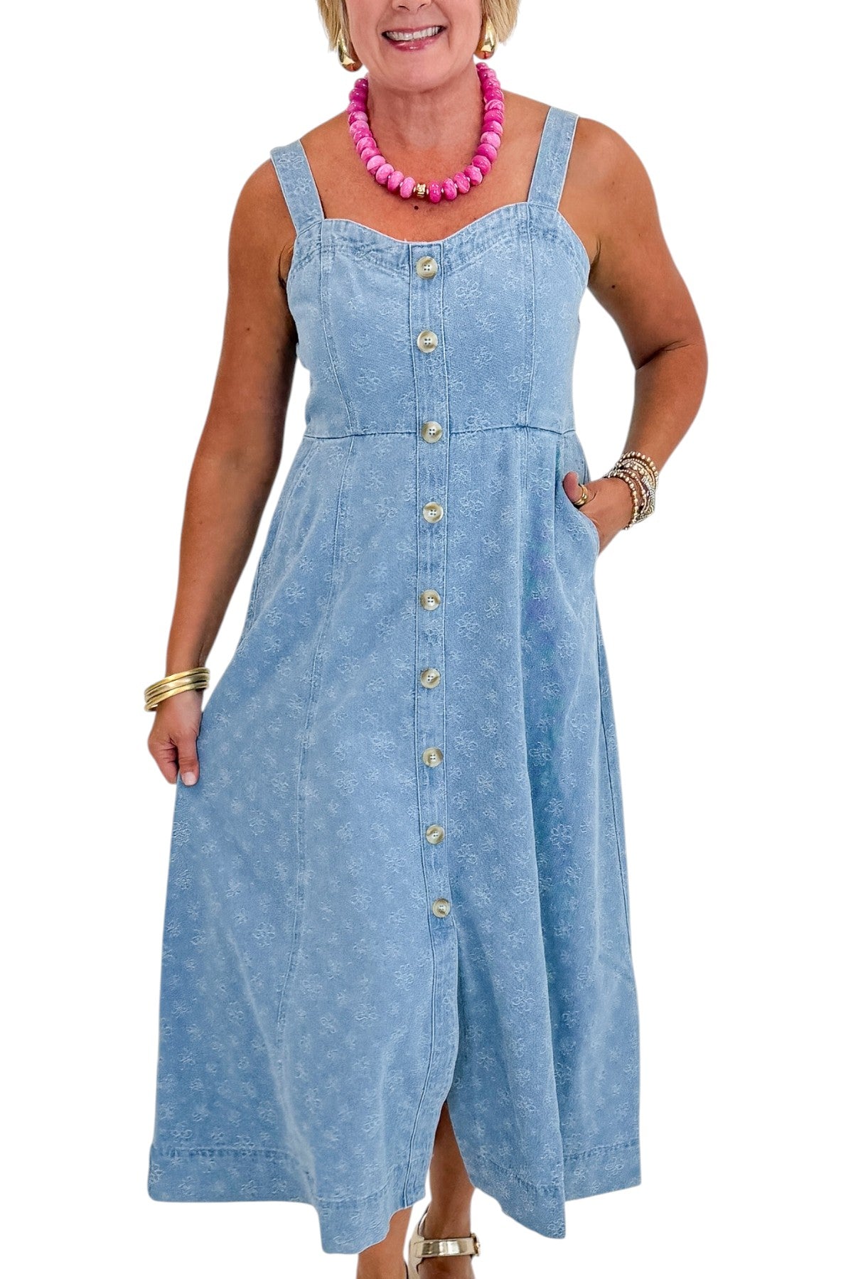 Front detail view of woman wearing Swagger Boutique’s Denim Floral Textured Midi Dress with wedges against white studio background.