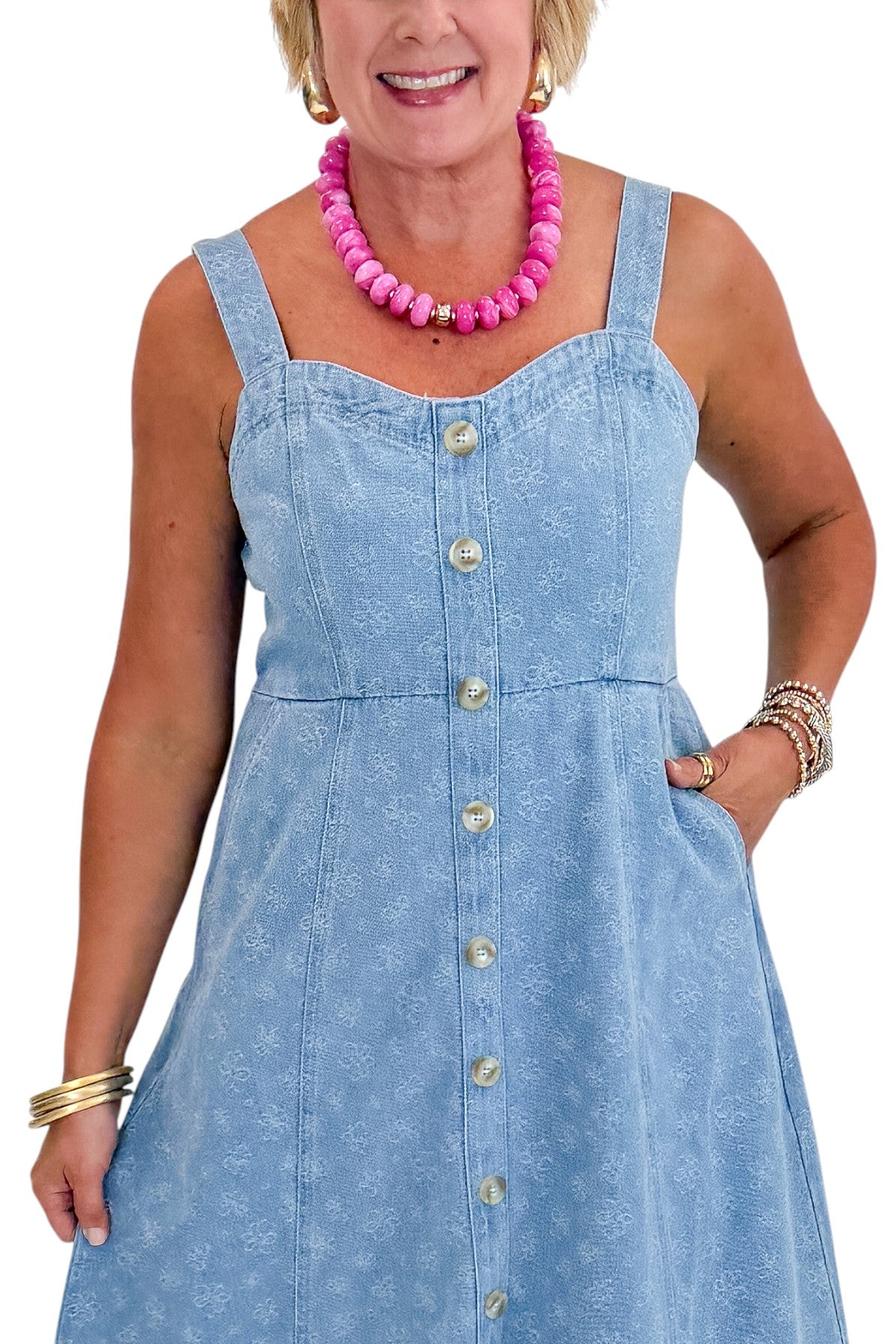 Front detail view of woman wearing Swagger Boutique’s Denim Floral Textured Midi Dress with wedges against white studio background.