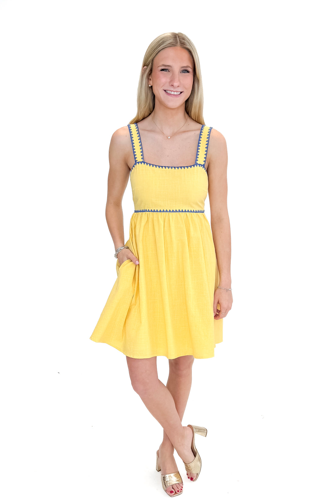 Front view of woman wearing Yellow With Blue Whipstitch Bow Back Dress against white studio background.