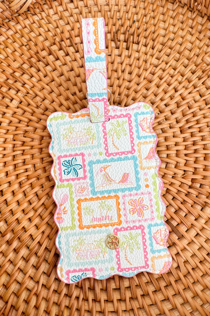 Colorful patchwork-style luggage tag on a woven surface