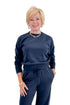 Front view of woman wearing Swagger Boutique’s Eclipse Breakaway Track Pants by Z Supply with Eclipse Comeback Sweatshirt by Z Supply against white studio background.