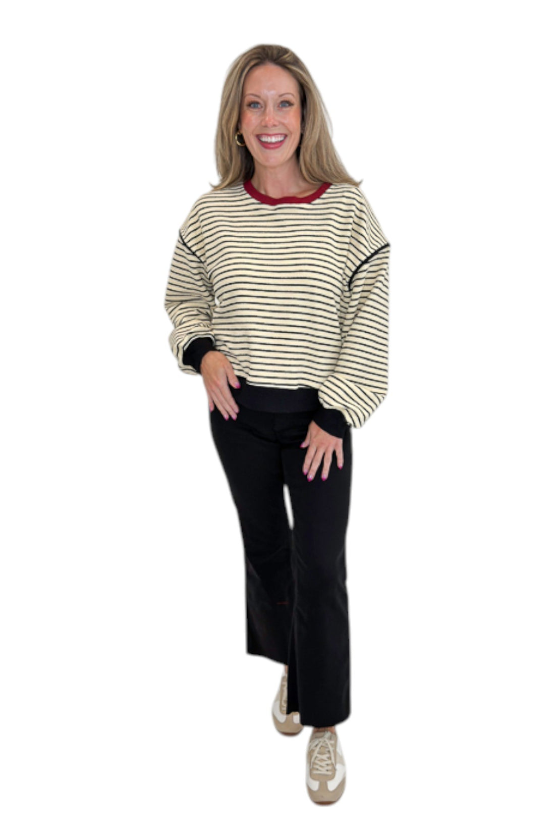 Front view of woman wearing Swagger Boutique’s Ecru &amp; Black Striped Sweatshirt by Entro with jeans against white studio background.