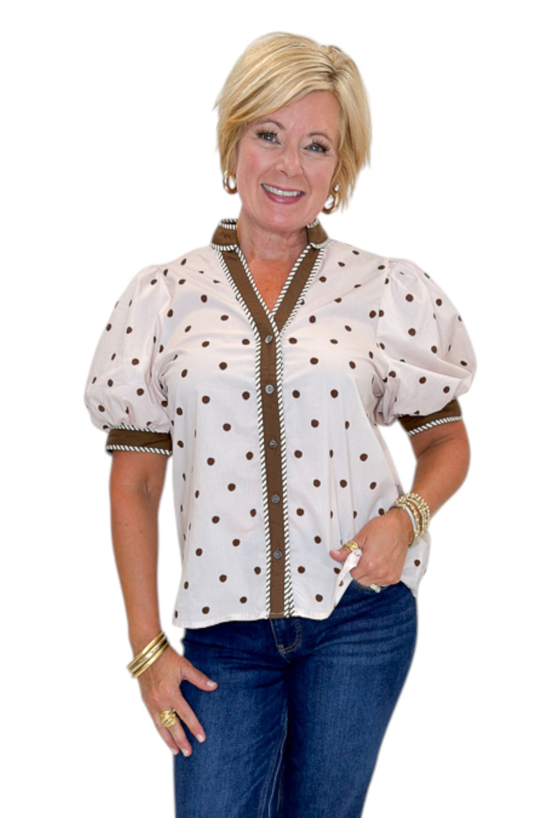 Front view of woman wearing Swagger Boutique’s Ecru &amp; Brown Polka Dot Button Up Top by Entro with jeans against white studio background.