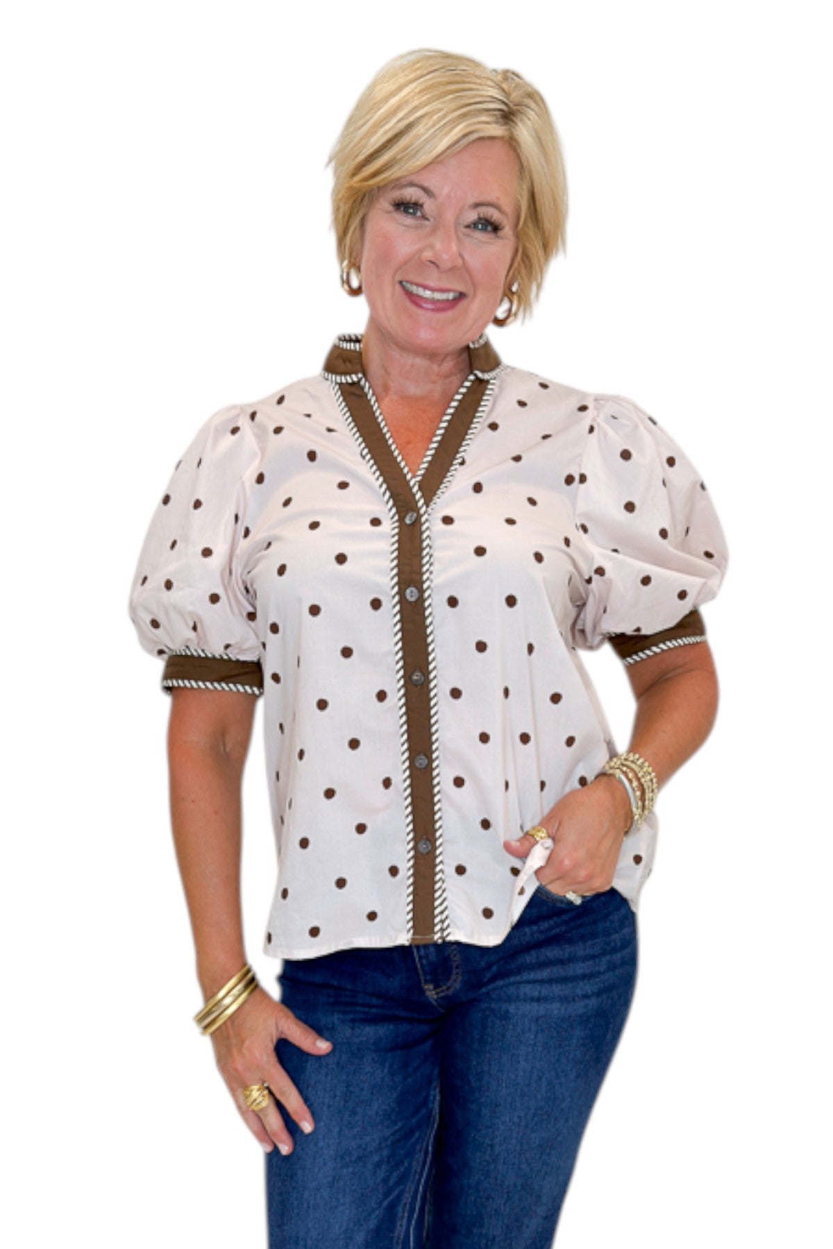 Front view of woman wearing Swagger Boutique’s Ecru &amp; Brown Polka Dot Button Up Top by Entro with jeans against white studio background.