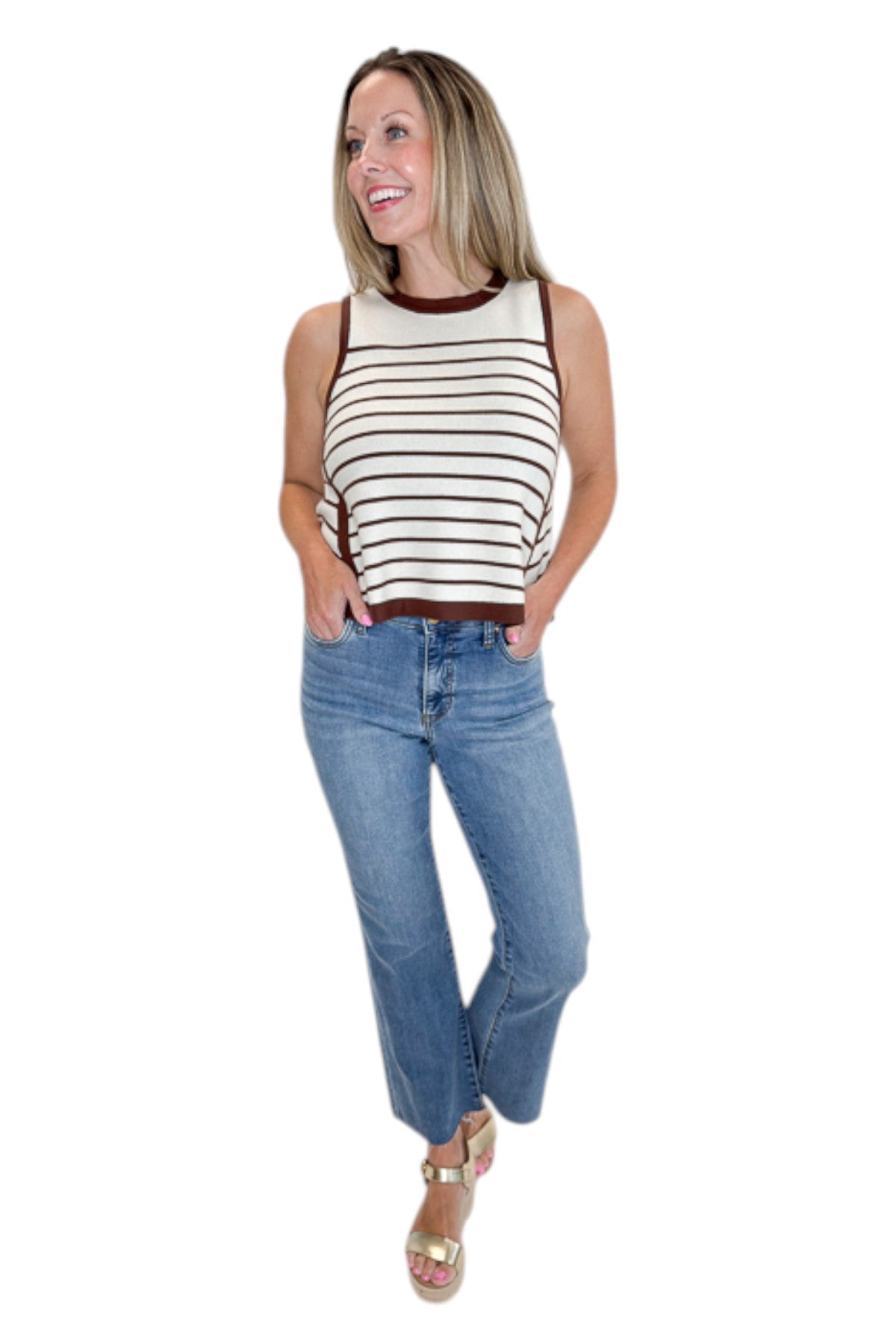 Front view of woman wearing Swagger Boutique’s Ecru &amp; Brown Striped Tank with jeans against white studio background.