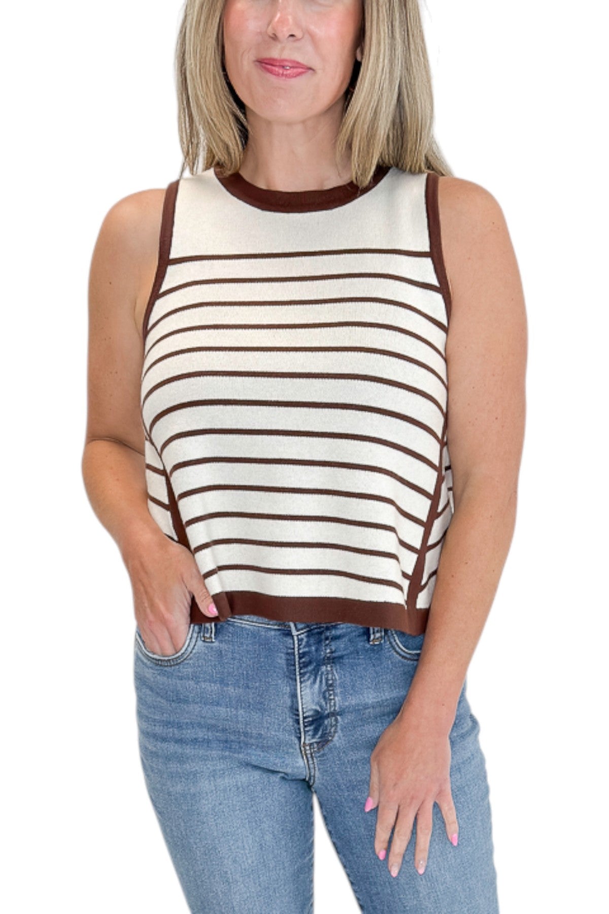Front detail view of woman wearing Swagger Boutique’s Ecru &amp; Brown Striped Tank with jeans against white studio background.