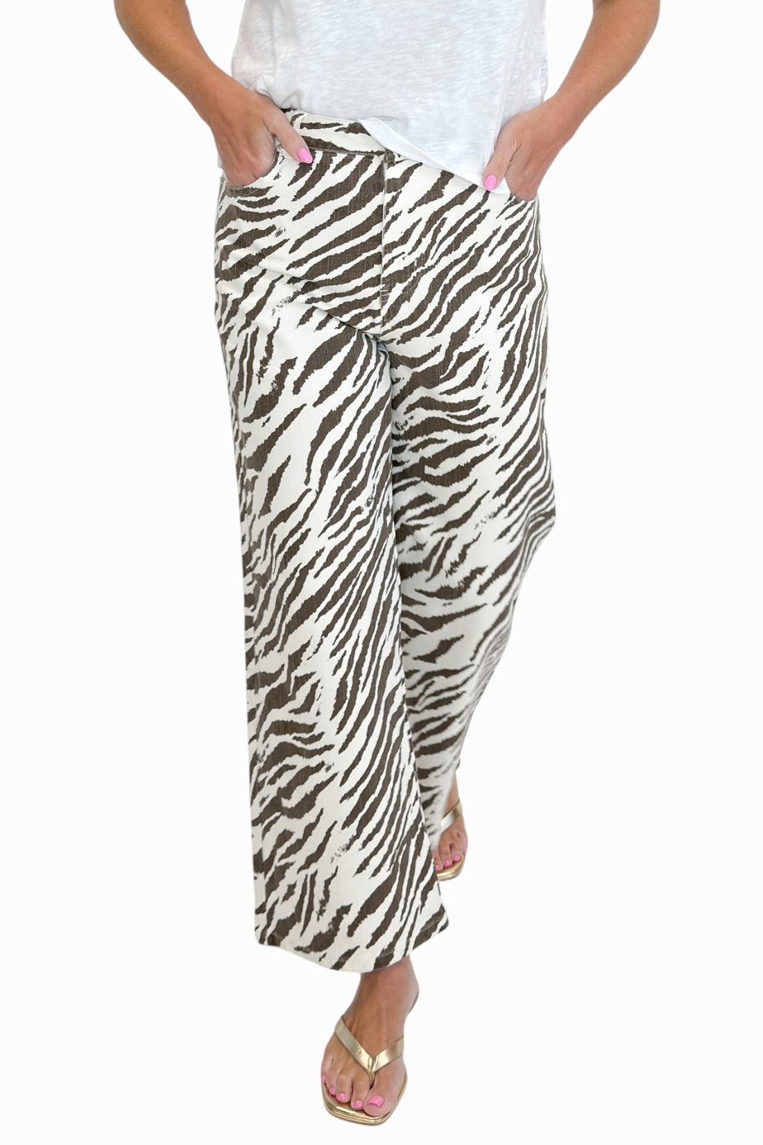 Front view of woman wearing Swagger Boutique’s  zebra jeans against white studio background.