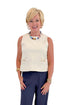 Front view of woman wearing Swagger Boutique’s Ecru Horsebit Buckle Tank by Entro with Navy High Waisted Trousers by Skies Are Blue against white studio background.