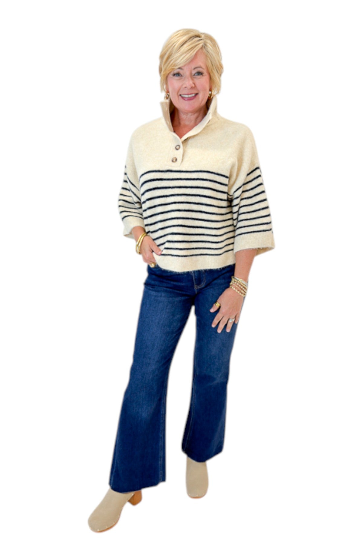 Front view of woman wearing Swagger Boutique’s Ecru &amp; Navy Striped 3/4 Sleeve Sweater by Entro with jeans against white studio background.