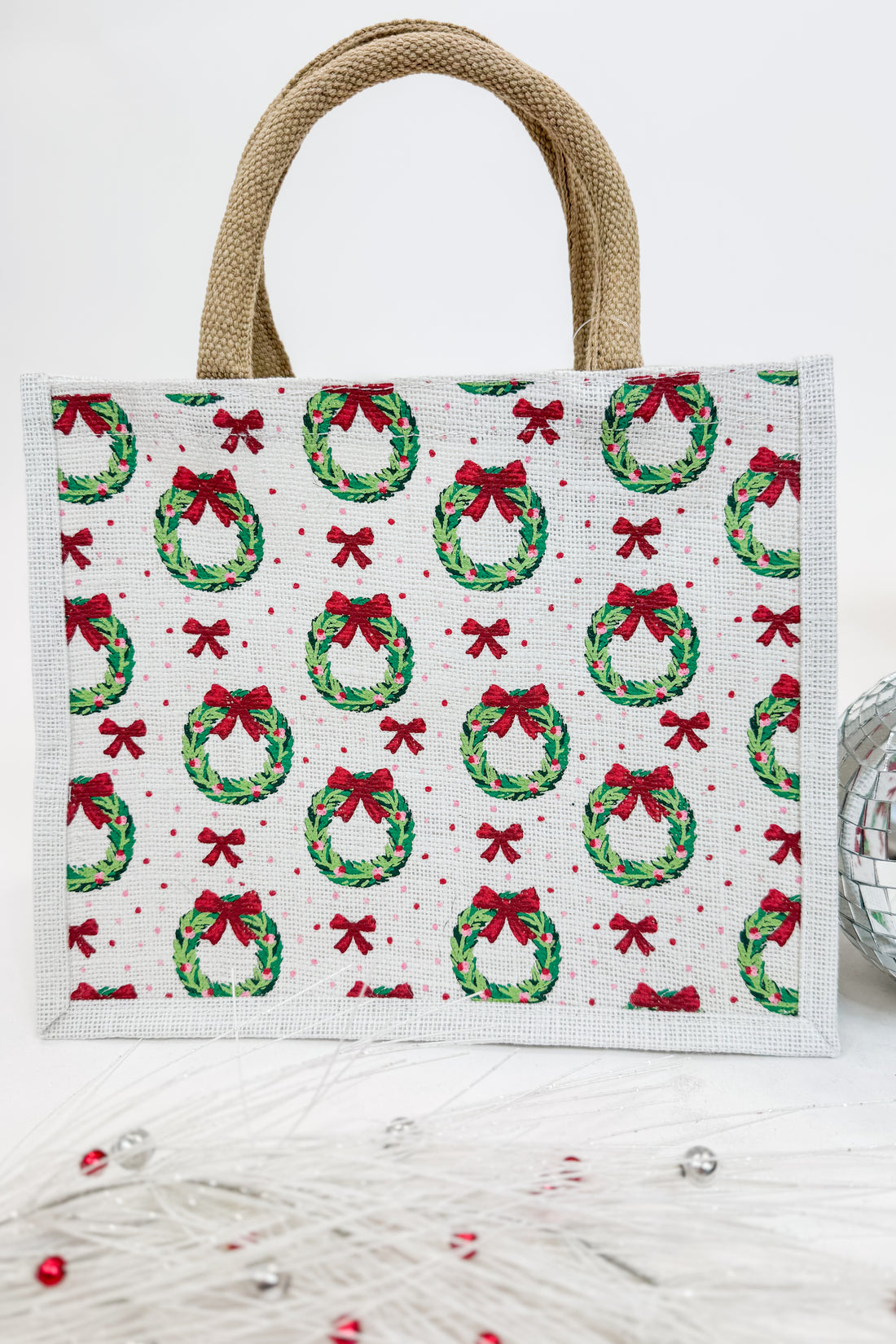 Tote bag with Christmas wreath and bow pattern on a white background