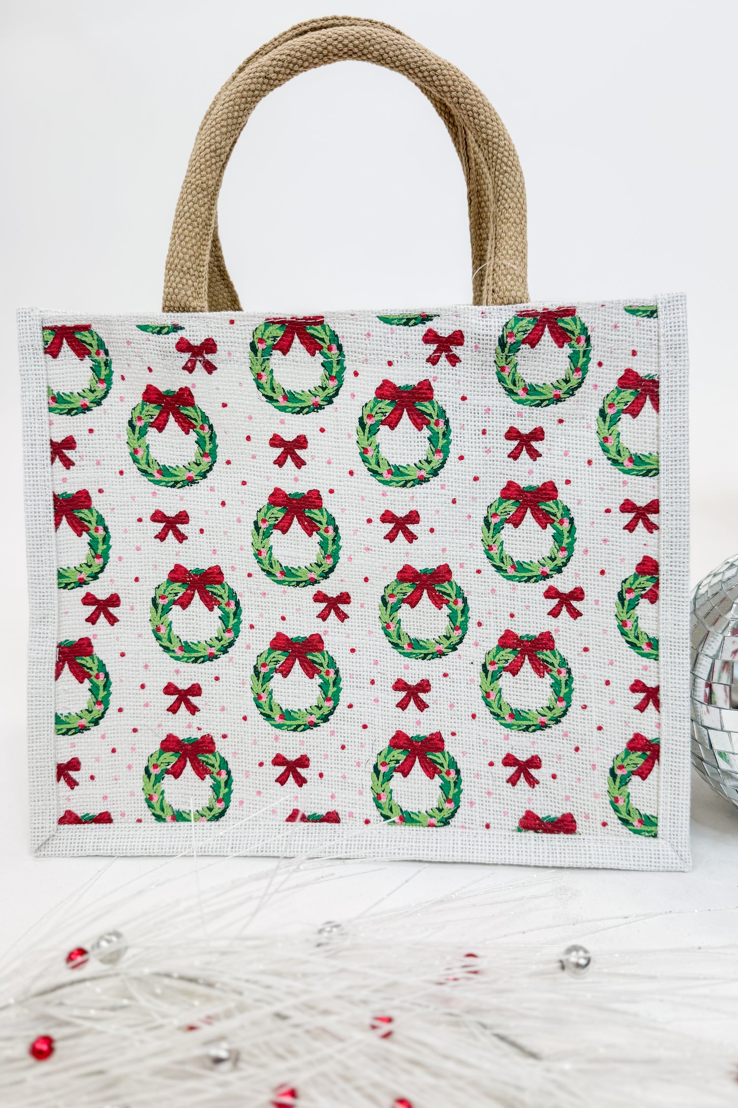 Tote bag with Christmas wreath and bow pattern on a white background