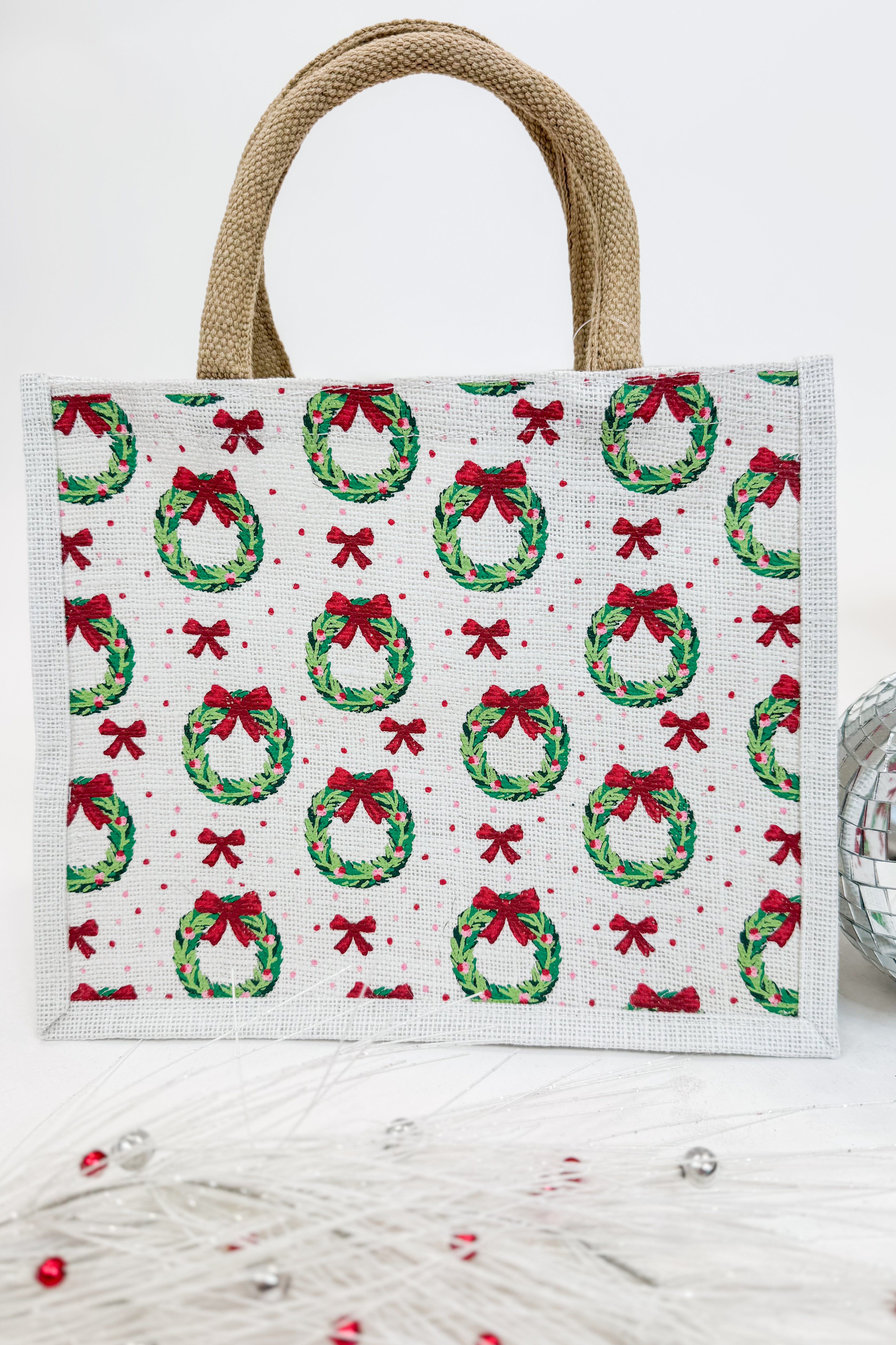 Tote bag with Christmas wreath and bow pattern on a white background