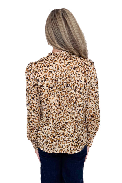 Back view of woman in a studio wearing Taupe Leopard Long Sleeve Top by Fate and jeans against a white background. 