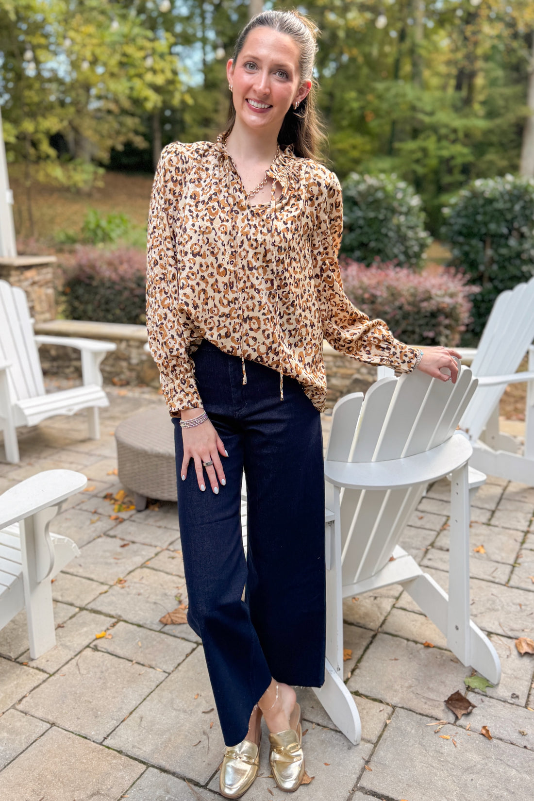 Woman outside wearing Taupe Leopard Long Sleeve Top by Fate and jeans.