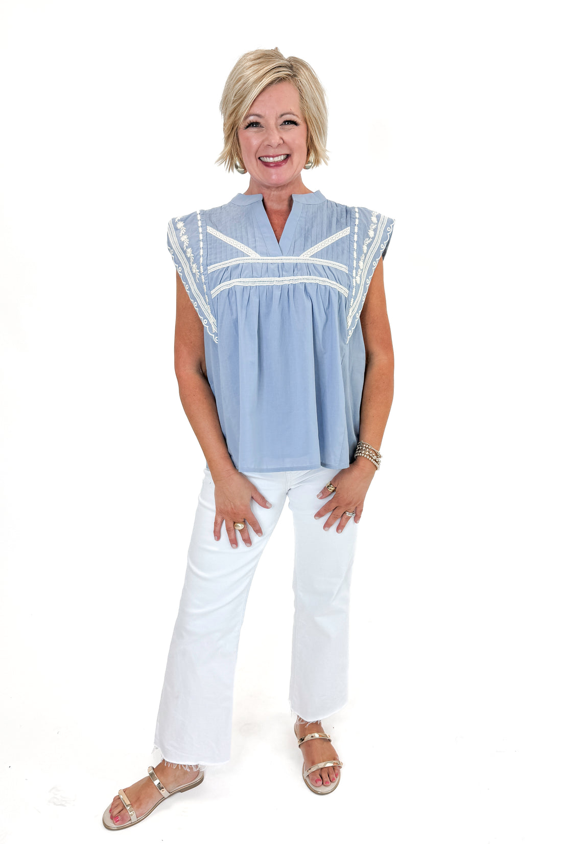 Front view of woman wearing Light Blue Embroidered Detail Top by Fate with jeans against white studio background.